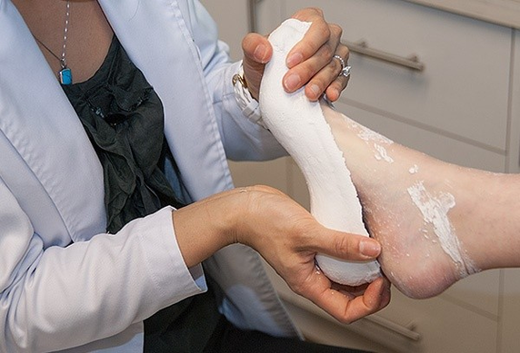 I have been to two podiatrists and have had 3 pairs of orthotics over 2 years, I still have pain in my feet after 2 minutes. What's my next step?